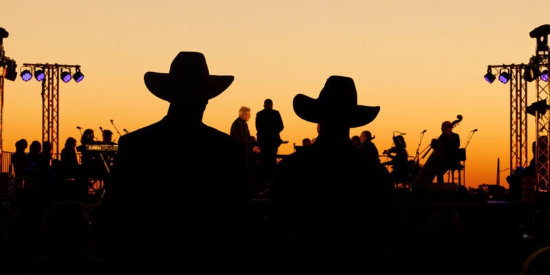 silouettes of crowd and performers at Festival of Outback Opera Singing In The Night event 2024