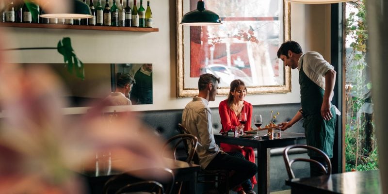 A couple being served at Fico restaurant in Hobart, Tasmania, Australia