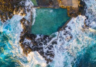 Aerial overlooking Blowhole Point Rock Pool, Kiama
