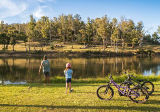 a father and daughter with their bicycles at Hadspen River