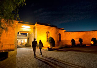 two people entering Old Mount Gambier Gaol at night