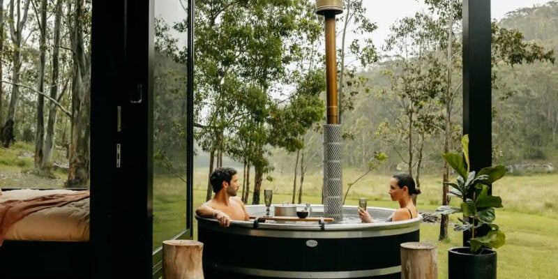 a couple relaxing in the outdoor tub at Billy’s Hideaway, Hunter valley