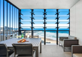 dining with views of Newcastle beach at Executive Beach Apartment