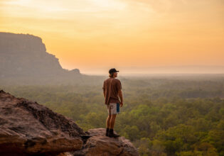 a man standing on top of Nawurlandja Lookout