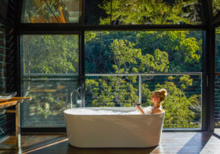a woman dipping in the tub at Spicers Sangoma, Bowen Mountain