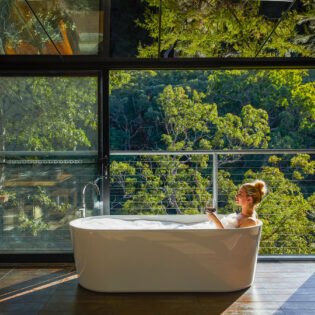 a woman dipping in the tub at Spicers Sangoma, Bowen Mountain