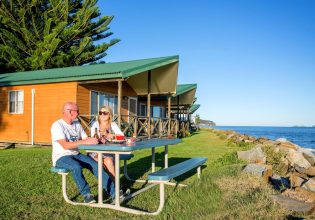 a couple al fresco dining at BIG4 Batemans Bay at East's Riverside Holiday Park