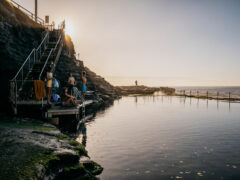 People swimming at the Bogey Hole Newcastle