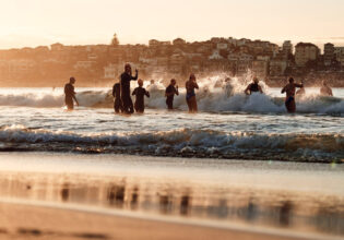 Locals run into the water at Bondi Beach