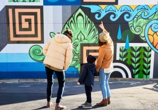 Family admire street art in Braddon Canberra