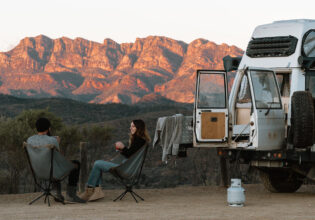 Couple sitting on camping chairs at Bunyeroo Valley Lookout