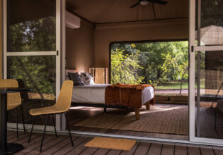 the bedroom interior inside the tent at Cooinda Lodge