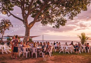 People relaxing at Darwin Ski Club at sunset