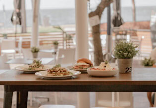 Views of the beach and food at De Ja Vu Cafe & Bar