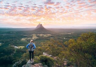 Woman hiking Glasshouse Mountains