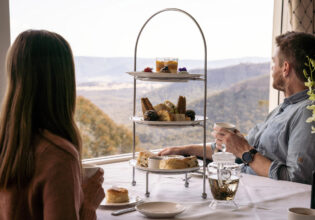 Couple enjoying the views at Hydro Majestic Wintergarden High Tea