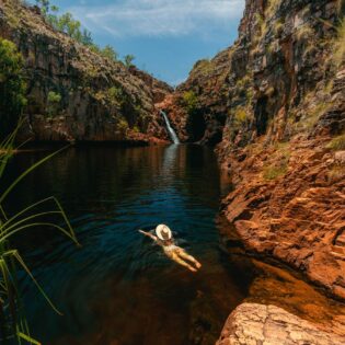 a girl swimming in Maguk in Kakadu