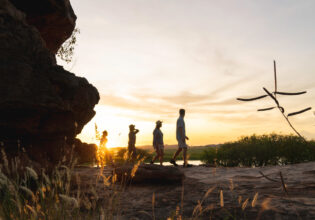 people walking at sunset during Kakadu Cultural Tours
