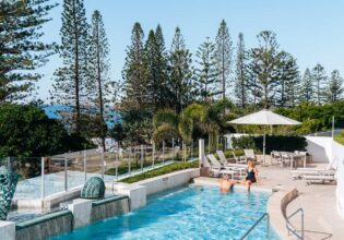 Couple enjoy pool at Oceans Mooloolaba Beach