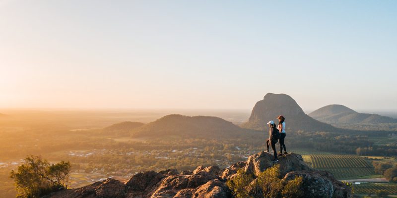 Standing at the top of Mount Ngungun at sunrise near Brisbane after hike