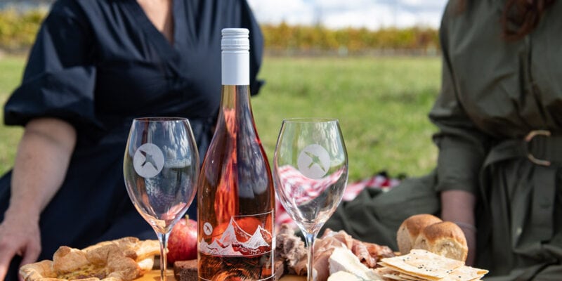 Two women enjoying a platter while on Printhie Helicopter Ultimate Winery Tour