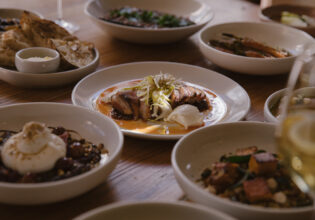 A variety of plates of food at Tempus