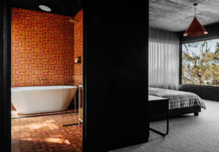 Interior view of the bedroom and bathroom at Slow Beam in Hobart