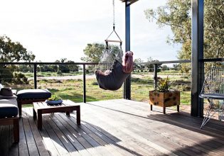 Woman sitting in a swing hammock in Callubri Station, NSW, Australi